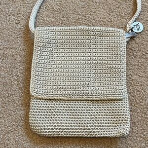 Beige The Sak crossbody bag in excellent condition. Zipper inner pocket.